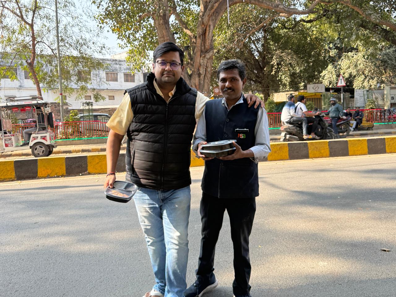Triveni team members with food packets prepared for the Kumbh food donation drive